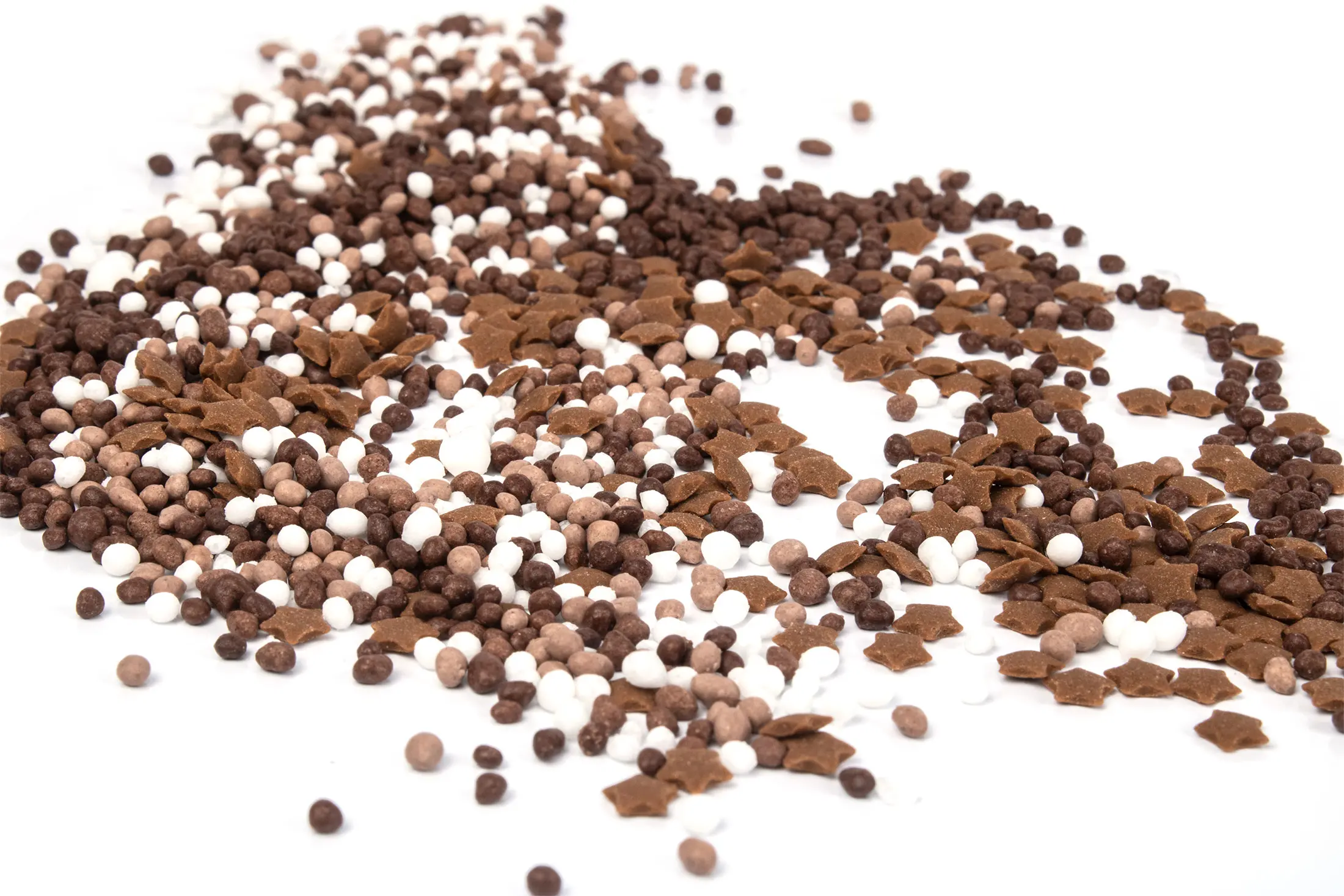 Cocoa decorations scattered across a white background
