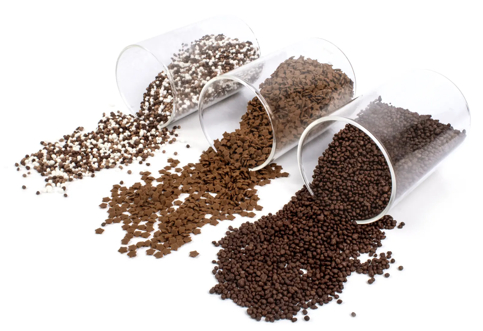 Selection of Cocoa products spilling from transparent containers