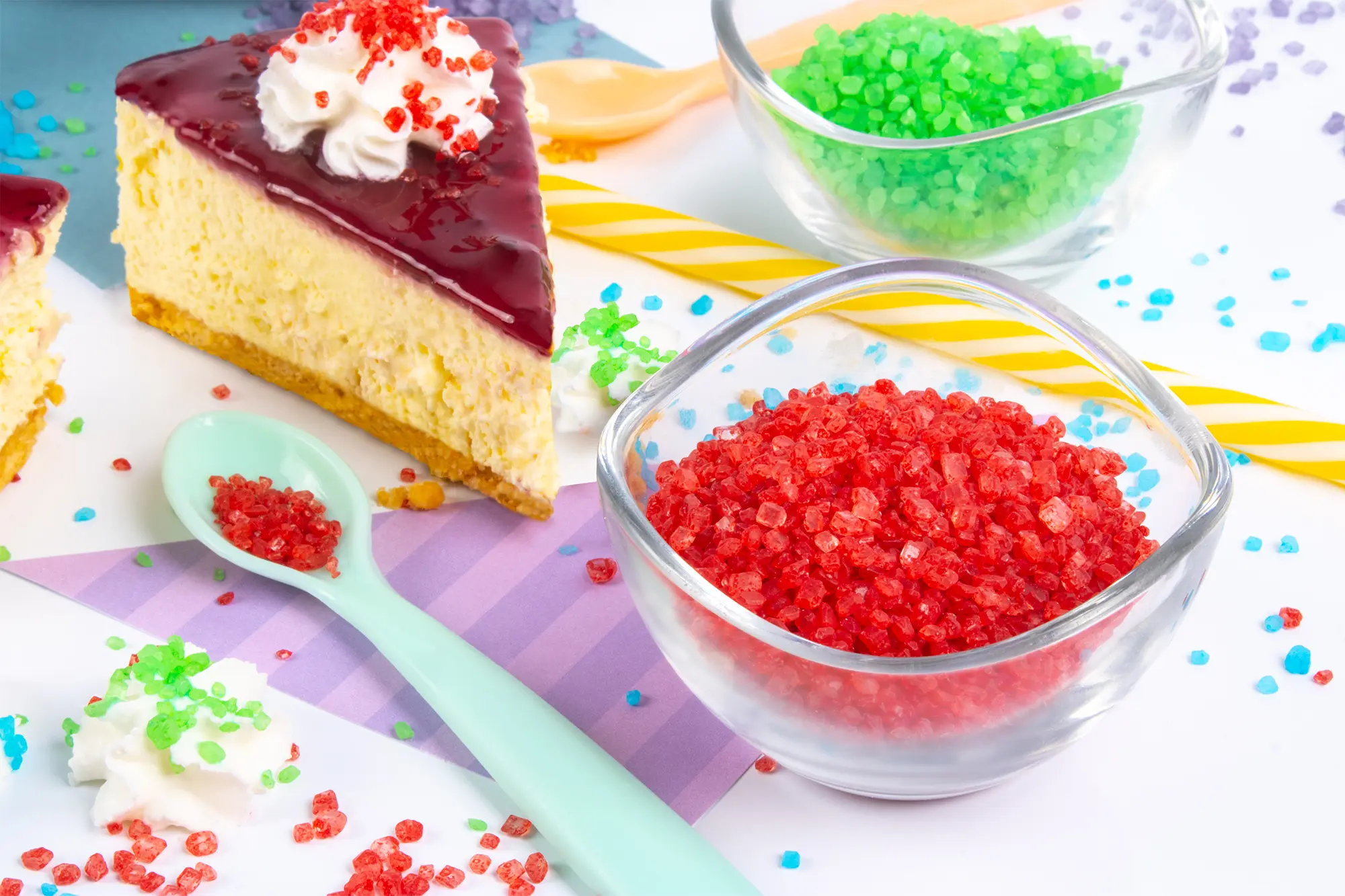 Cake and bowls decorated with colourful sugar crystals