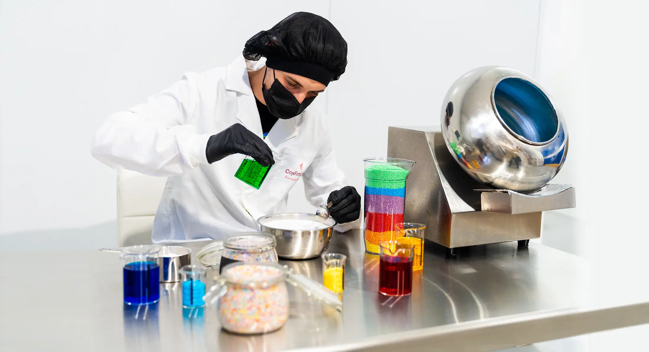 ConfetiCakes laboratory technician preparing coloured sugar decorations