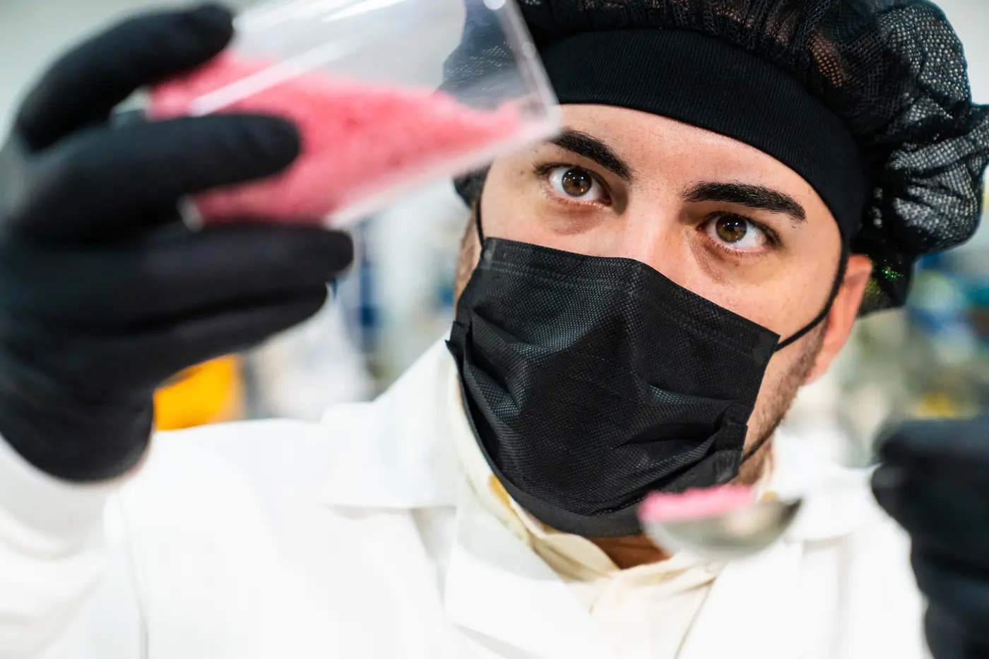 Quality technician analysing a sample in the ConfetiCakes laboratory