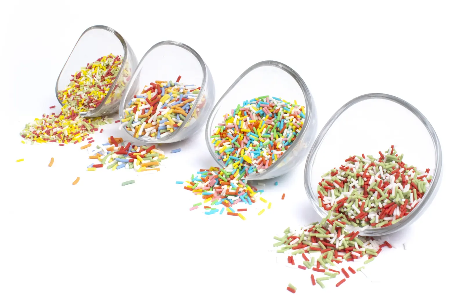 Selection of Sugar Strands products spilling from glass containers
